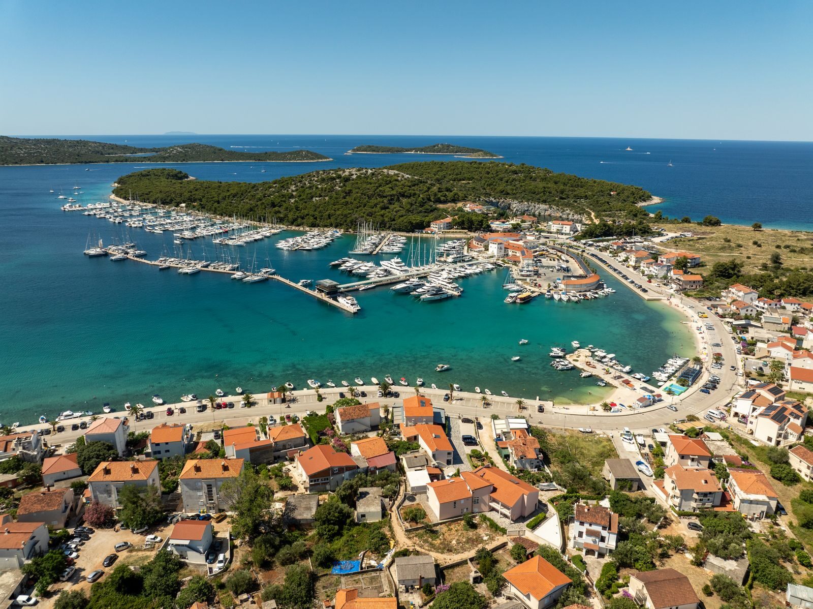 Scenic aerial view of marina and coastline in Rogoznica, Croatia during summer.