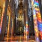 Sagrada Familia interior with vibrant stained glass light in Barcelona.