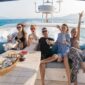 a group of people sitting on a boat