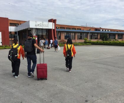 Travellers with luggage walking to the Arrival hall at Tribhuvan International Airport, Kathmandu